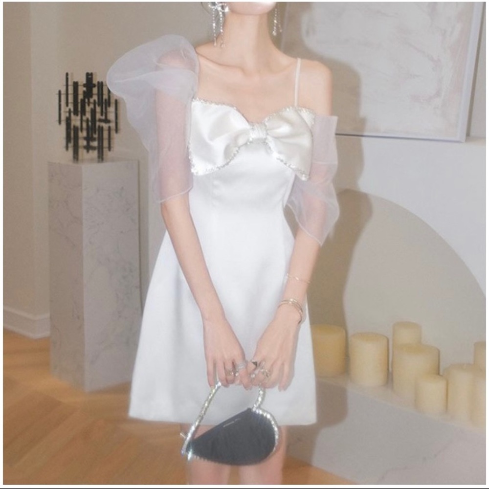 Size 6. White dress with bow, rhinestones, and tulle puff sleeves. - Picture 3 of 3